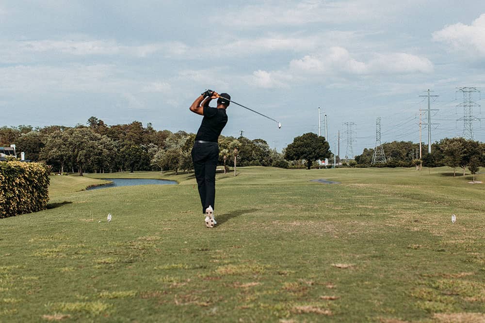 golfer with fairway wood